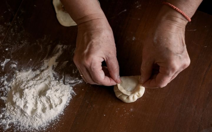 Italian grandma making ravioli - The Proud Italian