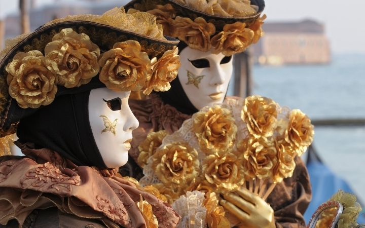 People in masks, Why you need to plan your next trip to the Venice Carnival - The Proud Italian