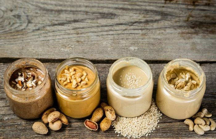 different nut butters in jars
