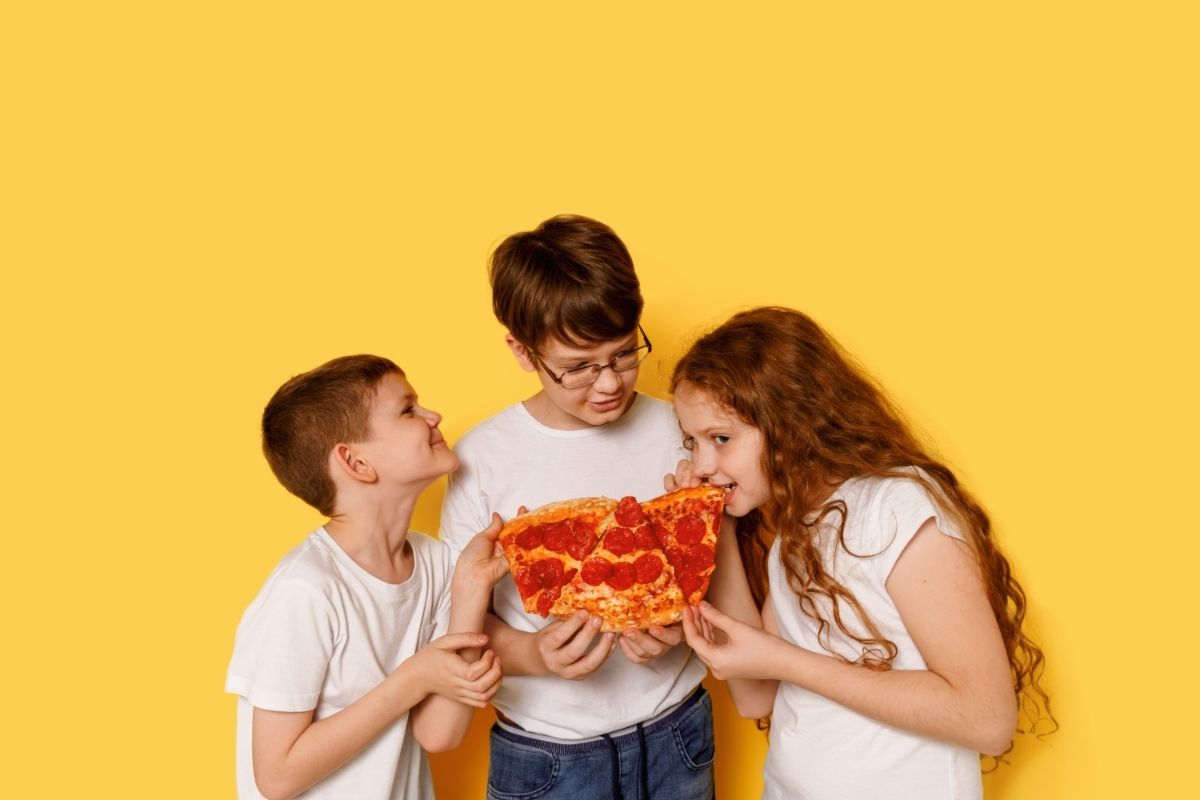 Children Eating Pepperoni Pizza 