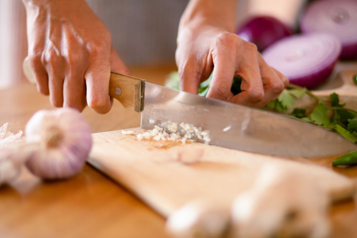 A Person Chopping Garlic