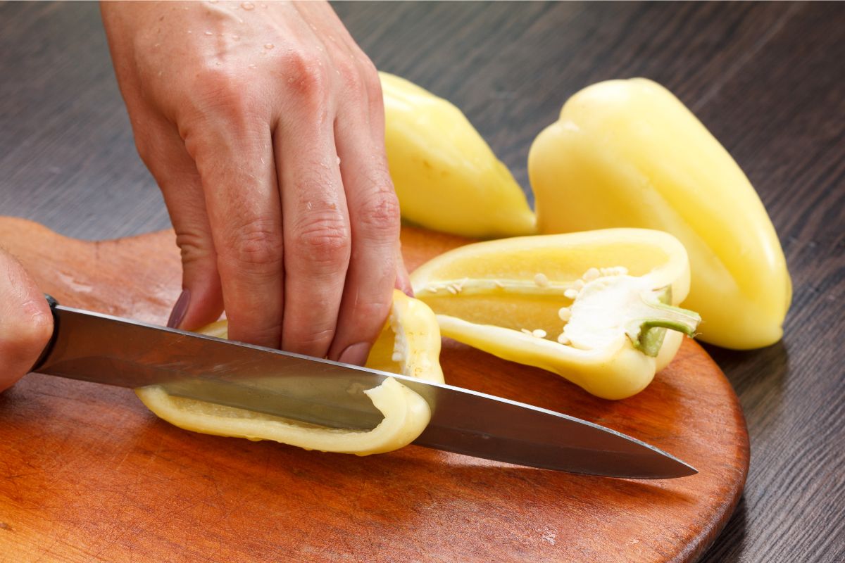 Cutting yellow bell pepper