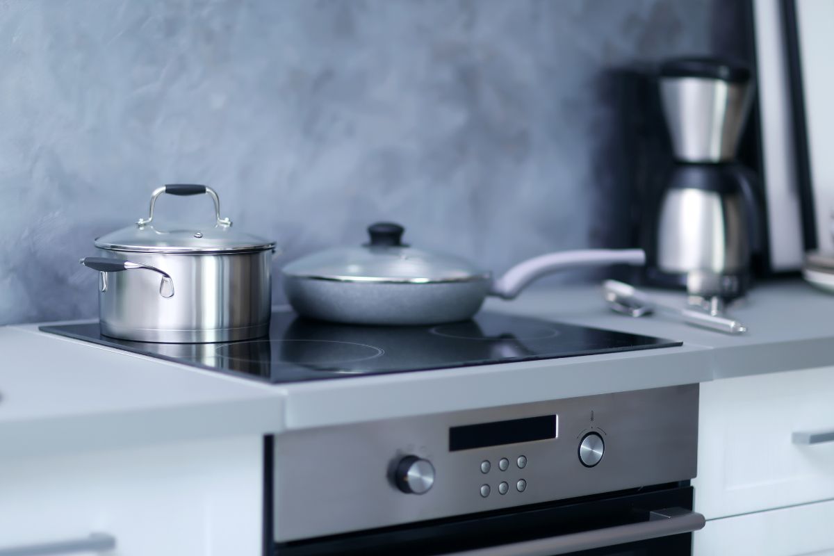 Modern electric stove with cookware