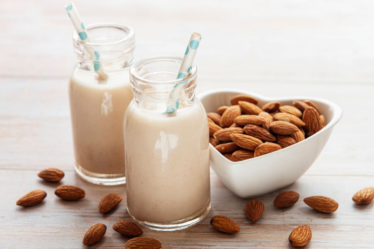 Bottles with almond milk and almonds